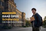 Student holding a DAAD EPOS scholarship award letter in front of a German university