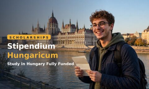 Student holding a Stipendium Hungaricum scholarship award letter in Budapest, Hungary