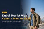 Traveller holding a passport in front of the Dubai skyline — Dubai tourist visa guide